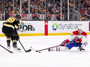 Canadiens defender Jeff Petry (26) defends Boston Bruins right wing David Pastrnak (88) during the second period at TD Garden in Boston on Sunday, Nov. 14, 2021.
