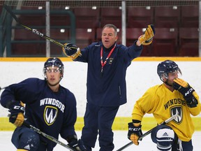 Head coach Kevin Hamlin, center, has his University of Windsor Lancers men's hockey team in first place after the club's third win of the season over the No. 7 Western Mustangs on Saturday by a 6-3 count. .