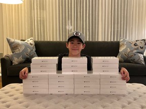 Jonathan (Bear) Yeung with some of the tablets and iPads he donated to BC Children's Hospital in 2020.