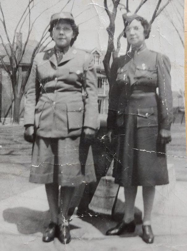 Nellie Cusick (left) and Mable Green, Marilyn Ryerson's mother and grandmother, pose in their military uniforms in this undated family photo.  Ryerson said they would be devastated to learn that Canadian flags would be raised while there are still graves at residential school sites across the country.