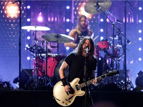 Foo Fighters' Dave Grohl and Taylor Hawkins perform after the band was inducted into the Rock and Roll Hall of Fame in Cleveland, Ohio on October 30, 2021.