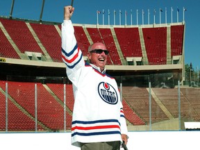 Edmonton Oilers president Patrick LaForge rejoices after shooting a ceremonial puck into the net on the plastic surface installed at Commonwealth Stadium for the press conference.  A hockey rink was erected on the Commonwealth Stadium field to test conditions for the Heritage Classic NHL hockey event that will take place in Edmonton in November.