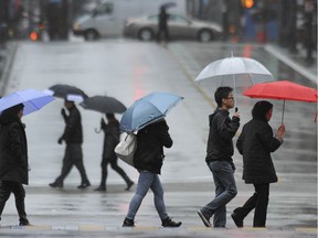 Vancouverites are featured in this 2015 file photo during a Pineapple Express weather event.