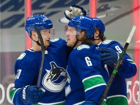 Elias Pettersson (left) and Brock Boeser in happier and more productive times last season.