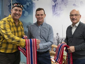 From left, Metis Nation Director Louis De Jaeger Darrell Fox and Métis Nation BC CEO Daniel Fontaine with the band honoring Terry Fox's mixed-race heritage.