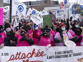 Daycare workers demonstrate to push overdue contract negotiations on Tuesday, Nov. 23, 2021, in Montreal.