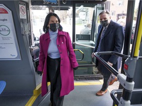 Quebec Prime Minister François Legault and Montreal Mayor Valérie Plante board an electric bus in Montreal on Monday, November 22, 2021.