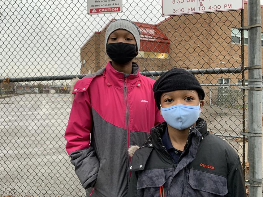 Soji Adesokun's children, Philip, 6, and Ruth, 10, were vaccinated against COVID-19 at their school, St. Francis de Sales, on Thursday. "It was easy," Ruth said.