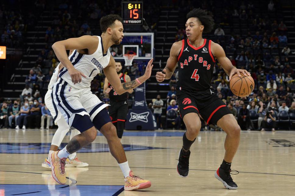 Toronto Raptors forward Scottie Barnes (right) watches the scene as he is protected by Memphis Grizzlies forward Kyle Anderson in their game Wednesday night.