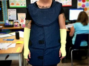 This is an educator at a school in southwestern Ontario who wears a padded vest and face shield to protect her from violent students.