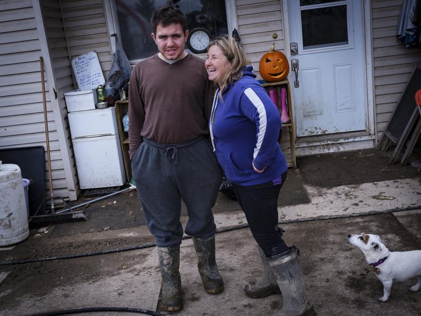 Tricia Simons jokes with her son Michael on the farm she runs with her partner, Pascal Gauthier, and two other sons.