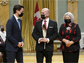 CP-Web.  Prime Minister Justin Trudeau, left, and Governor General Mary May Simon, right, pose with Randy Boissonnault, Minister of Tourism and Associate Minister of Finance, at a cabinet swearing-in ceremony at Rideau Hall in Ottawa, Tuesday, October 26. .  , 2021.