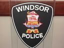 Windsor Police Service insignia on a podium at headquarters.