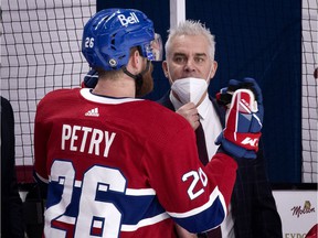 Montreal Canadiens head coach Dominique Ducharme speaks with defender Jeff Petry during the game against the Ottawa Senators in Montreal on March 2, 2021.