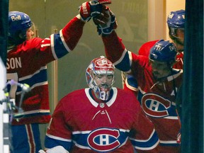 Montreal Canadiens Josh Anderson, left, high-fives Brendan Gallagher as goalie Carey Price takes his team to the ice for Game 3 of the playoffs against the Vegas Golden Knights in Montreal on June 18, 2021. It was downhill after that. Serie.