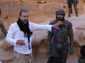 Denis Villeneuve and Javier Bardem on the set of Dune.  By mid-December, the sci-fi epic had grossed nearly $ 400 million, earning Villeneuve the green light for a second installment.