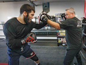 Light heavyweight world champion Artur Beterbiev works with trainer Marc Ramsay at the Ramsay gym in Montreal on December 1, 2021, in preparation for his next fight.