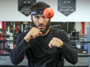 WBC / IBF light heavyweight champion Artur Beterbiev hits a ball with a strap attached to his head while training at the Ramsay Boxing Academy in Montreal on December 1, 2021 in preparation for his next fight at the Bell Center.