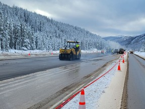 The temporary repairs needed to reopen the Coquihalla highway are nearing completion.  Here, the new road surface will be paved on December 14 at Murray Flats on Highway 5, where the highway and main culverts were washed away.