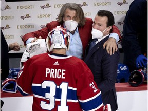 Montreal Canadiens general manager Marc Bergevin and assistant coach Luke Richardson congratulate goalkeeper Carey Price after defeating the Vegas Golden Knights in Game 6 on June 24, 2021.