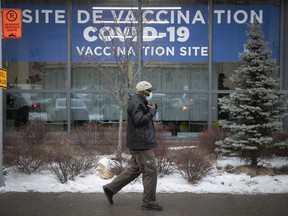 A man heads to the COVID-19 vaccination clinic on Parc Ave December 29, 2021.