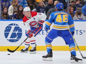 Nick Suzuki of the Montreal Canadiens controls the puck against the St. Louis Blues during the second period at the Enterprise Center in St Louis on December 11, 2021.