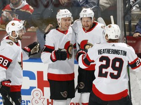 Dylan Gambrell of the Ottawa Senators is congratulated by his teammates after he scored a goal in the second period against the Florida Panthers at the FLA Live Arena on Tuesday, December 14, 2021 in Sunrise, Florida.
