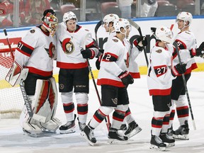 Ottawa Senators goalie Anton Forsberg is congratulated by his teammates after their 8-2 win against the Florida Panthers at the FLA Live Arena on December 14, 2021 in Sunrise, Florida.