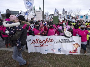 Daycare workers demonstrate to push lagging contract negotiations on November 23, 2021, in Montreal.