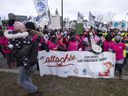 Daycare workers demonstrate to push back overdue contract negotiations Tuesday, Nov. 23, 2021, in Montreal.