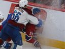 Canadiens' Josh Anderson (17) is crashed into the draw by Avalanche's Kurtis MacDermid during the second period Thursday night.  Anderson was injured on the play and is expected to miss two to four weeks.