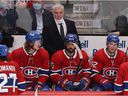 Montreal Canadiens head coach Dominique Ducharme looks towards the center of the ice, while players Michael Pezzetta (55), Mathieu Perreault (85) and Artturi Lehkonen (62) watch a goal from Cale Makar of Colorado Avalanche on Montreal on December 2, 2021.