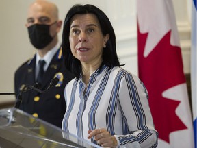 Mayor Valérie Plante speaks at a press conference in Montreal on Monday, November 29, 2021 as SPVM Deputy Chief Vincent Richer listens.  They announced that Montreal will hold a forum on gun violence in January.
