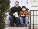 Mounin Yacoub is shown with his 7-year-old son Fauzi on Tuesday, December 7, 2021, at their Windsor home along with a $ 6,255 fine he received when he crossed the border back to Canada with the incorrect COVID-19 test.