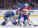 Charlie Lindgren of the Blues defends the goal against Artturi Lehkonen of the Canadiens during the second period at the Enterprise Center on Saturday, Dec. 11, 2021, in St Louis.