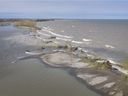 Strong winds have allowed a near-record Lake Erie to break through the beach barrier at Hillman Marsh, causing the lake's water to rush into the Leamington Swamp.  The gap is shown in this aerial photo from May 8, 2019.