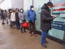 People line up at the COVID-19 testing clinic at the Gerry-Robertson Community Center in Pierrefonds-Roxboro on Wednesday, December 22, 2021. 