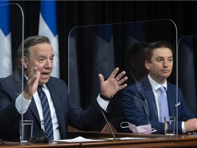Prime Minister François Legault and Simon Jolin-Barrette, the minister responsible for the French language, discuss the new Bill 96 in Quebec City on May 13, 2021.