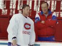 Head coach Jacques Demers seemed pleased to have Patrick Roy on the ice during the first day of the Montreal Canadiens' training camp at the Forum on September 12, 1995.  