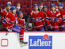 Canadiens, from left, Jonathan Drouin, Joel Armia, Jesse Ylonen, Laurent Dauphin, Artturi Lehkonen, Jake Evans and Ryan Poehling watch the action from the bench during the game against the Philadelphia Flyers in Montreal on December 16, 2021.