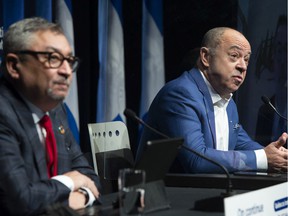 Quebec Health Minister Christian Dubé, right, and Public Health Director Horacio Arruda speak during a press conference on the pandemic in Montreal on Tuesday, December 28, 2021.