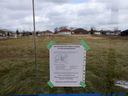 A neighborhood change notice is posted inside a North Talbot bus stop near Sixth Concession Road on Tuesday.