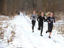 Massey High School runners, right, go for a run in the Spring Garden wilderness area in this February 2020 file photo.