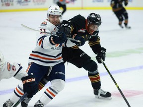 Giants captain Justin Sourdif (right), defending himself against Kamloops Blazer Logan Stankoven during a game last month, will lead his club against the visiting Blazers on Friday.