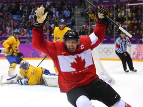 Sidney Crosby of Canada celebrates after scoring at the 2014 Olympics.