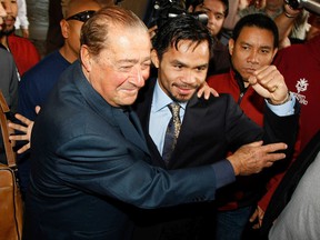 Boxing promoter Bob Arum, left, and boxer Manny Pacquiao arrive at the Mandalay Bay Resort and Casino on December 2, 2008 in Las Vegas.