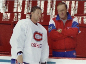 Head coach Jacques Demers seemed pleased to have Patrick Roy on the ice during the first day of the Montreal Canadiens' training camp at the Forum on September 12, 1995.