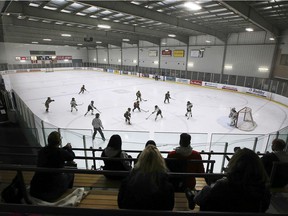 Parents watch their children participate in a minor hockey tournament at the WFCU Center on Friday, December 3, 2021.