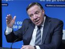 Quebec Prime Minister François Legault answers a question during a press conference in Montreal, Thursday, December 16, 2021.