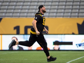 Tiger-Cats offensive lineman Chris Van Zeyl, seen running on the grass at Tim Hortons Field on Saturday, says the Gray Cup 